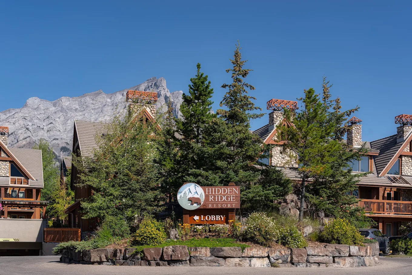 Hidden Ridge Resort entrance sign with Mount Rundle in the background